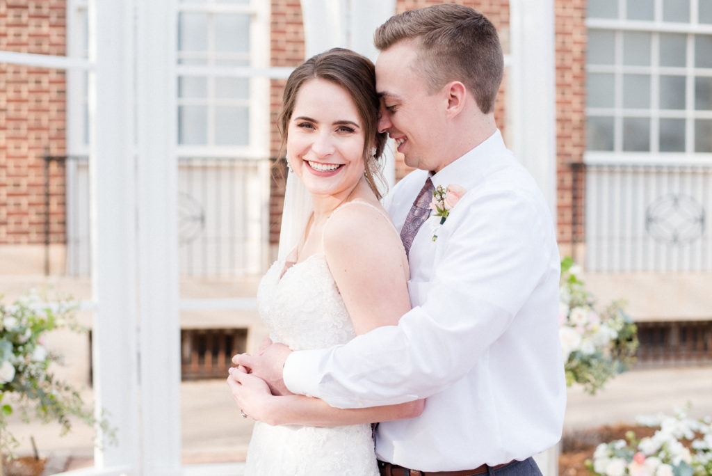 pretty in pink styled shoot bride and groom outside