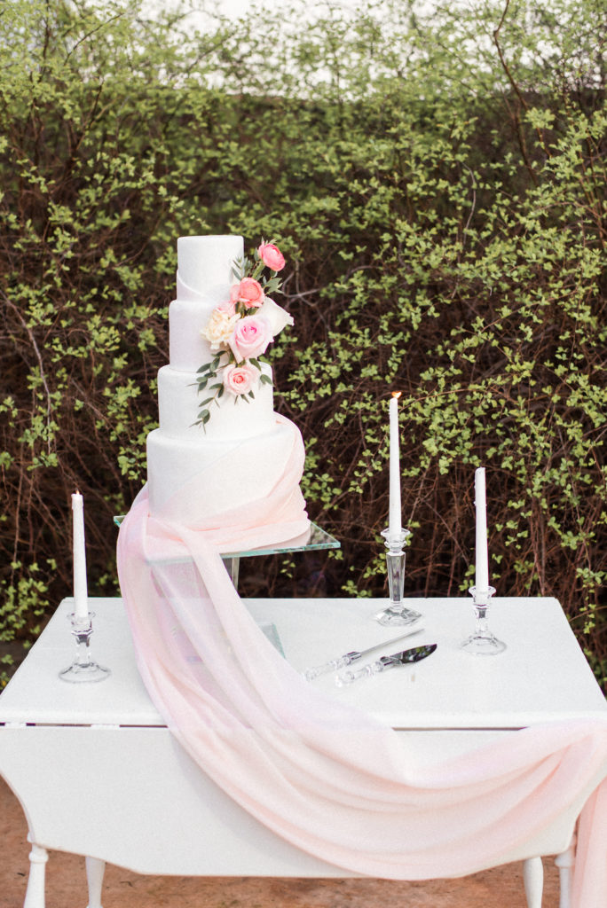 pink wedding cake setup