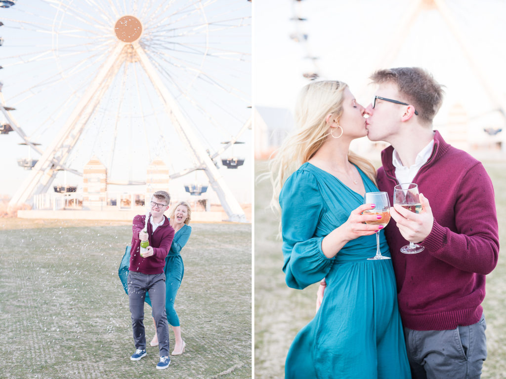 couple popping champagne by a ferris wheel