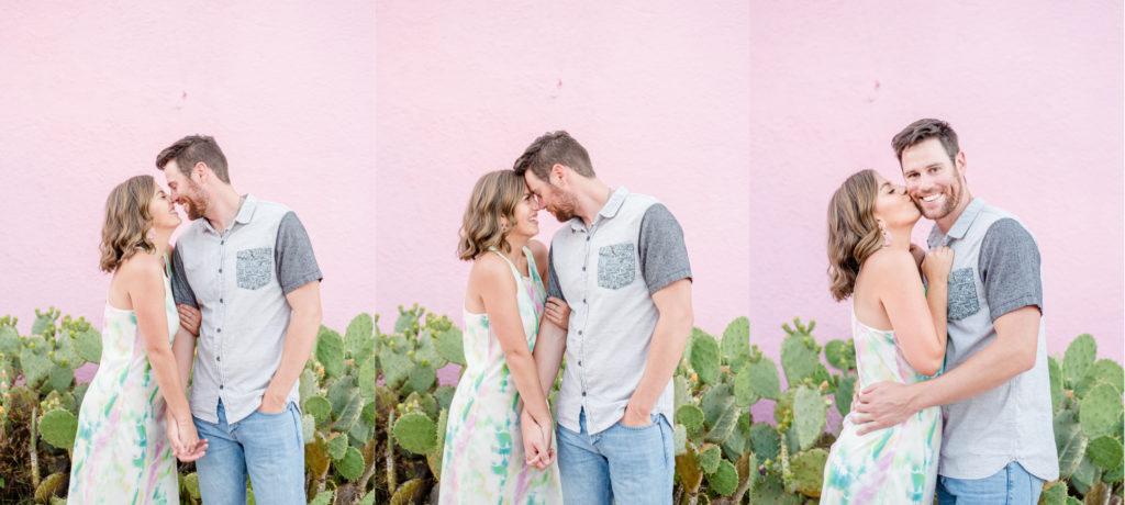 couple in front of pink wall
