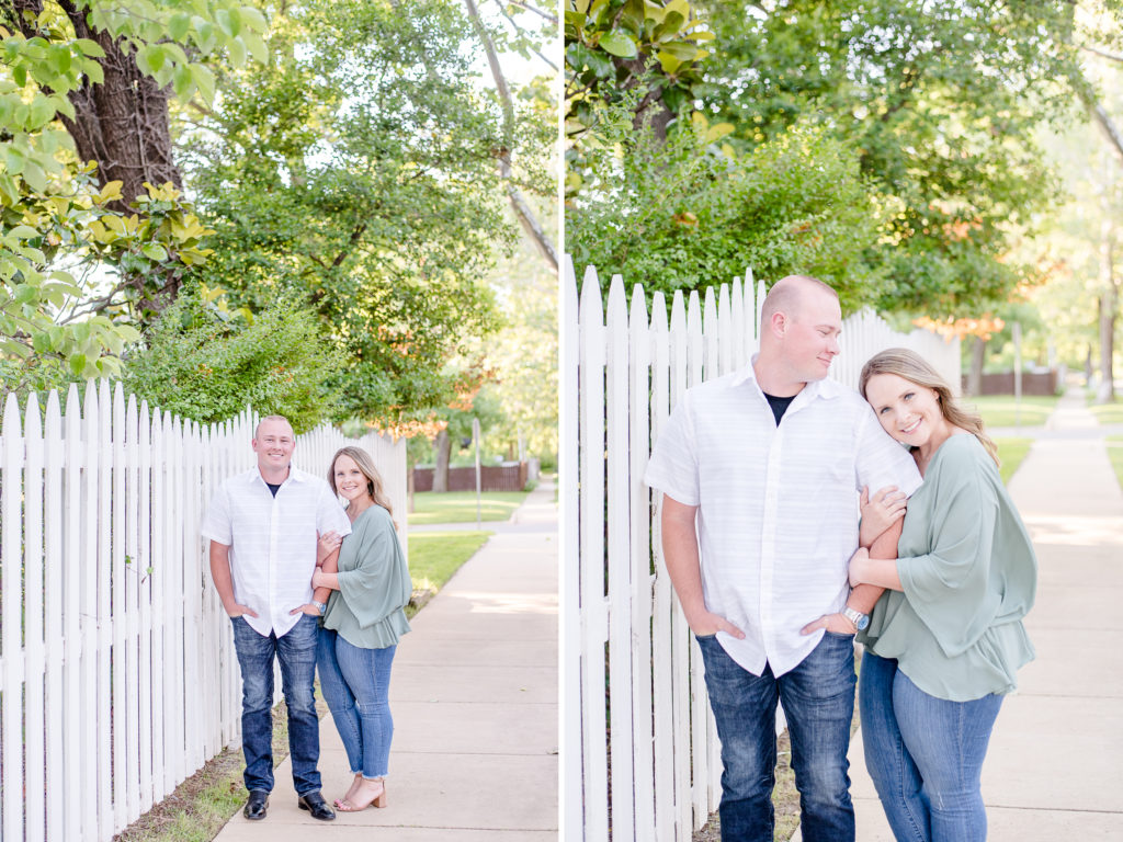couple by white picket fence