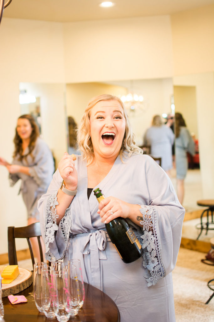 maid of honor popping bubbly