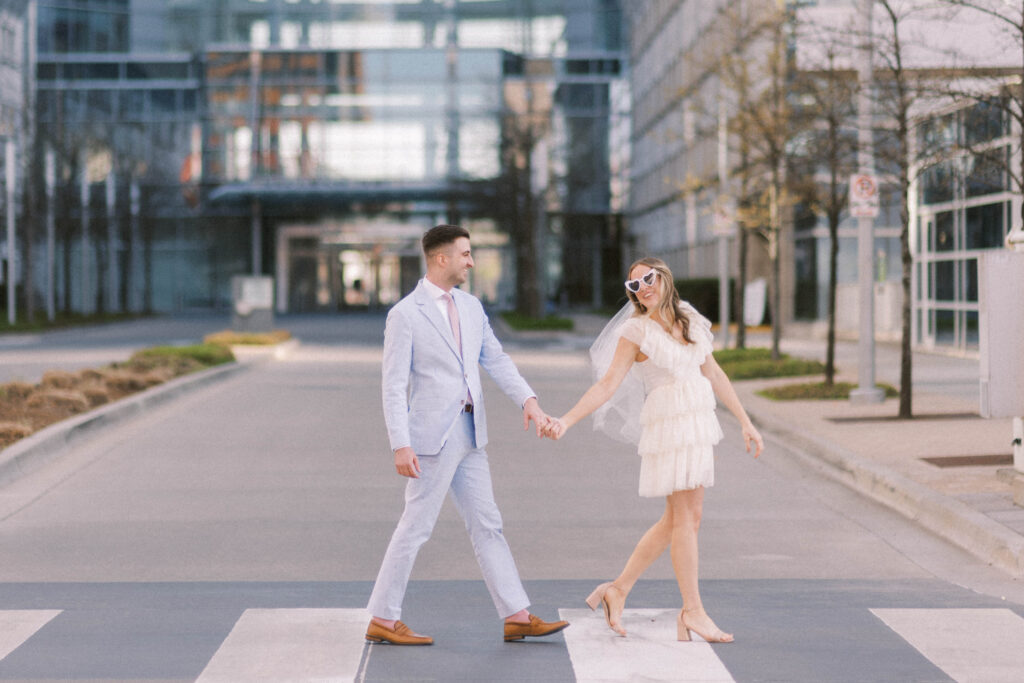 couple walking downtown engagement session