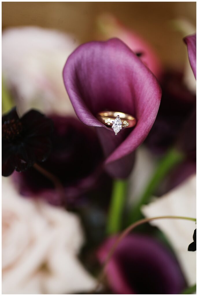 wedding ring in deep rich colored flower