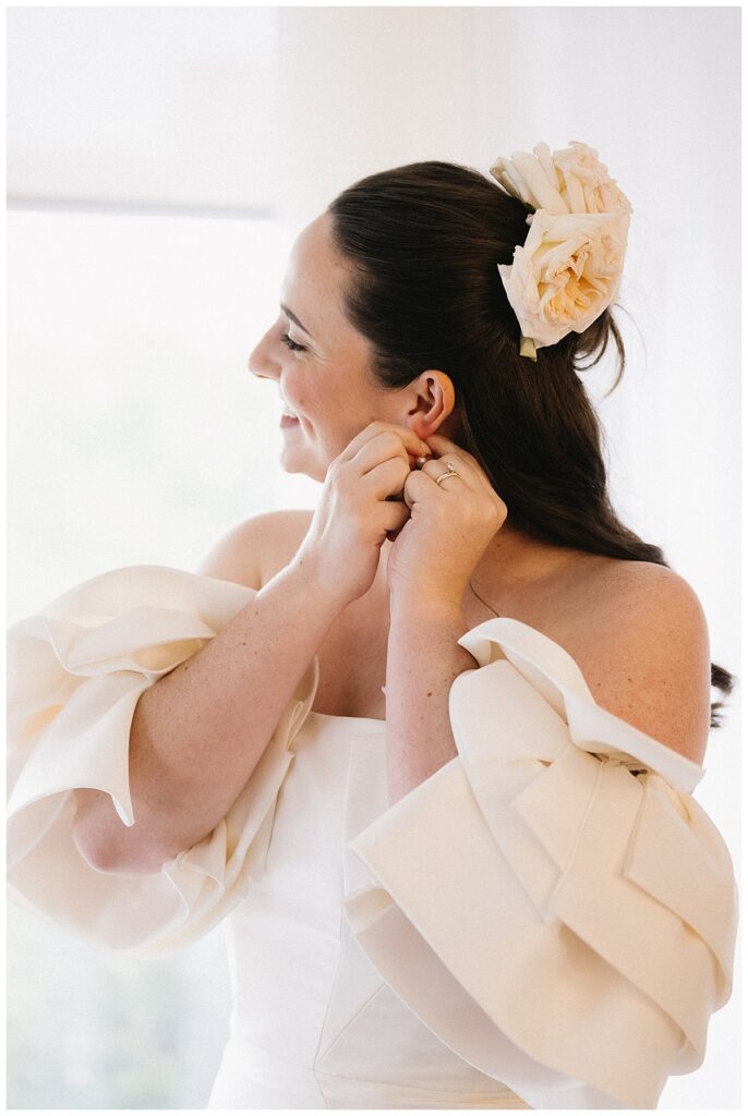 bride putting in her earrings