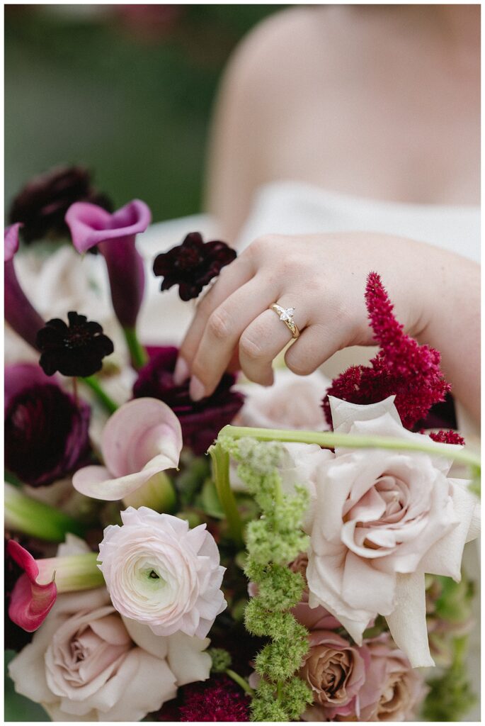 bride with jewel toned bouquet